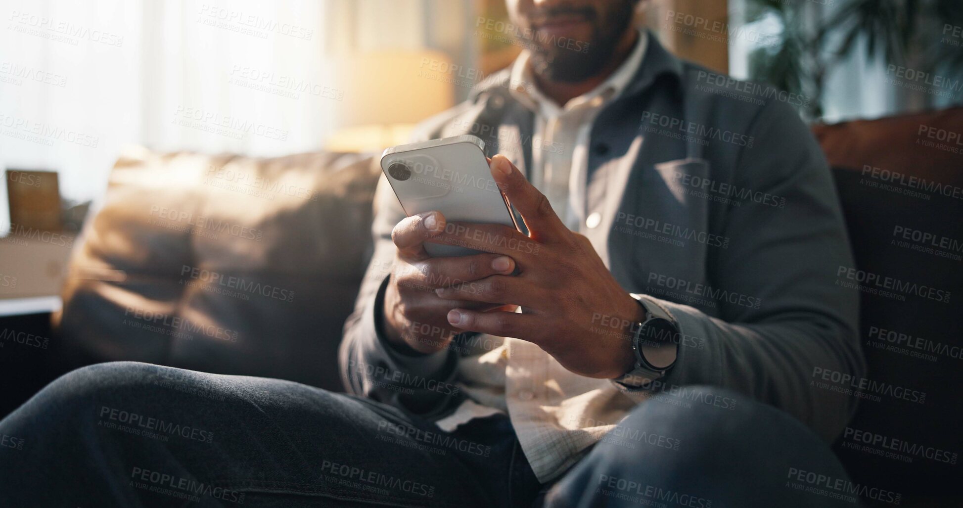 Buy stock photo Sofa, typing and man with phone on social media, online connection and text message on weekend. Living room, relaxing and hands of person on smartphone for website, contact and communication in home