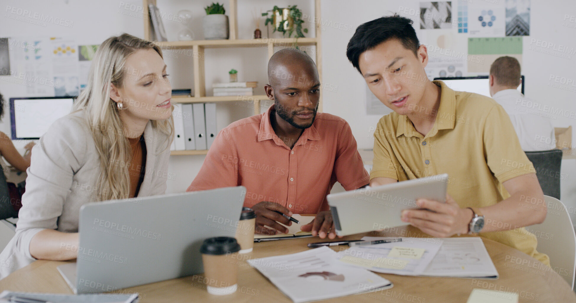 Buy stock photo Laptop, meeting and tablet with team in design workplace for planning or project management. App, conversation and diversity with designer people in coworking office for creative development