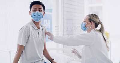 Buy stock photo Man, doctor and fear with injection for flu vaccine, immune system booster and face mask at clinic. Woman, medical expert and patient with ppe, scared or pharmaceutical shot for wellness at hospital