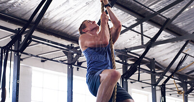 Buy stock photo Athlete, man and climbing with rope for fitness, exercise and training for body strength. Male person, equipment and intense workout for weightlifting, muscle endurance and power challenge in gym