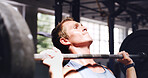 Man, fitness and weightlifting with barbell for muscle gain, workout or intense arm exercise in gym. Active, male person or lifting with weight for physical strength, training or power in health club