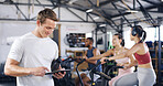 Man, personal trainer and tablet with people in spin class for fitness, schedule session and progress. Coach, digital app and tracking of cycling exercise, training performance and workout management