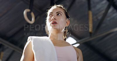 Buy stock photo Below, thinking and woman with towel for gymnastics fitness, exercise and planning for training. Thoughts, person and sweating from sports workout, preparation and decision for competition recovery