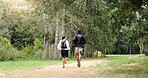 Running, forest and back of couple for fitness, exercise and cardio workout together in morning. Nature, hiking trail and man with woman training for wellness, health and challenge outdoor for hobby