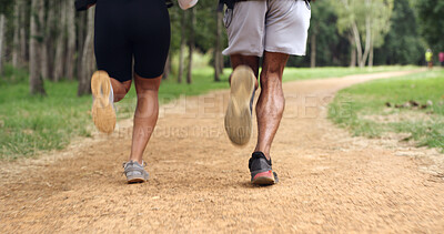 Buy stock photo Fitness, legs and couple running outdoor for health, wellness or training with back. Man, woman and shoes of trail runner in woods for cardio workout, endurance exercise or practice in nature