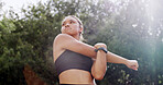 Woman, warm up and stretching arms outdoor for fitness, preparation and thinking for wellness. Nature, park and training for exercise with runner, getting ready and flexibility with low angle