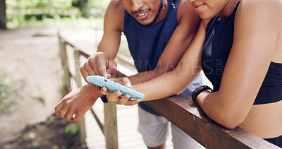 Buy stock photo Hands, outdoor and couple with cellphone, training and bonding together with social media. Network, man and woman with smartphone, exercise and digital app to track progress and message to contact