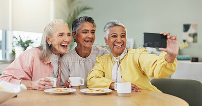 Buy stock photo Coffee, laughing and selfie with senior friends in dining room of home together for memories. Beverage, funny and photograph with old people in apartment for bonding, picture or social media