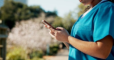 Buy stock photo Phone, hands or student nurse on campus with typing, research or notification for assignment. Email, healthcare or woman in uniform with tech, education or internet in school with info for results.