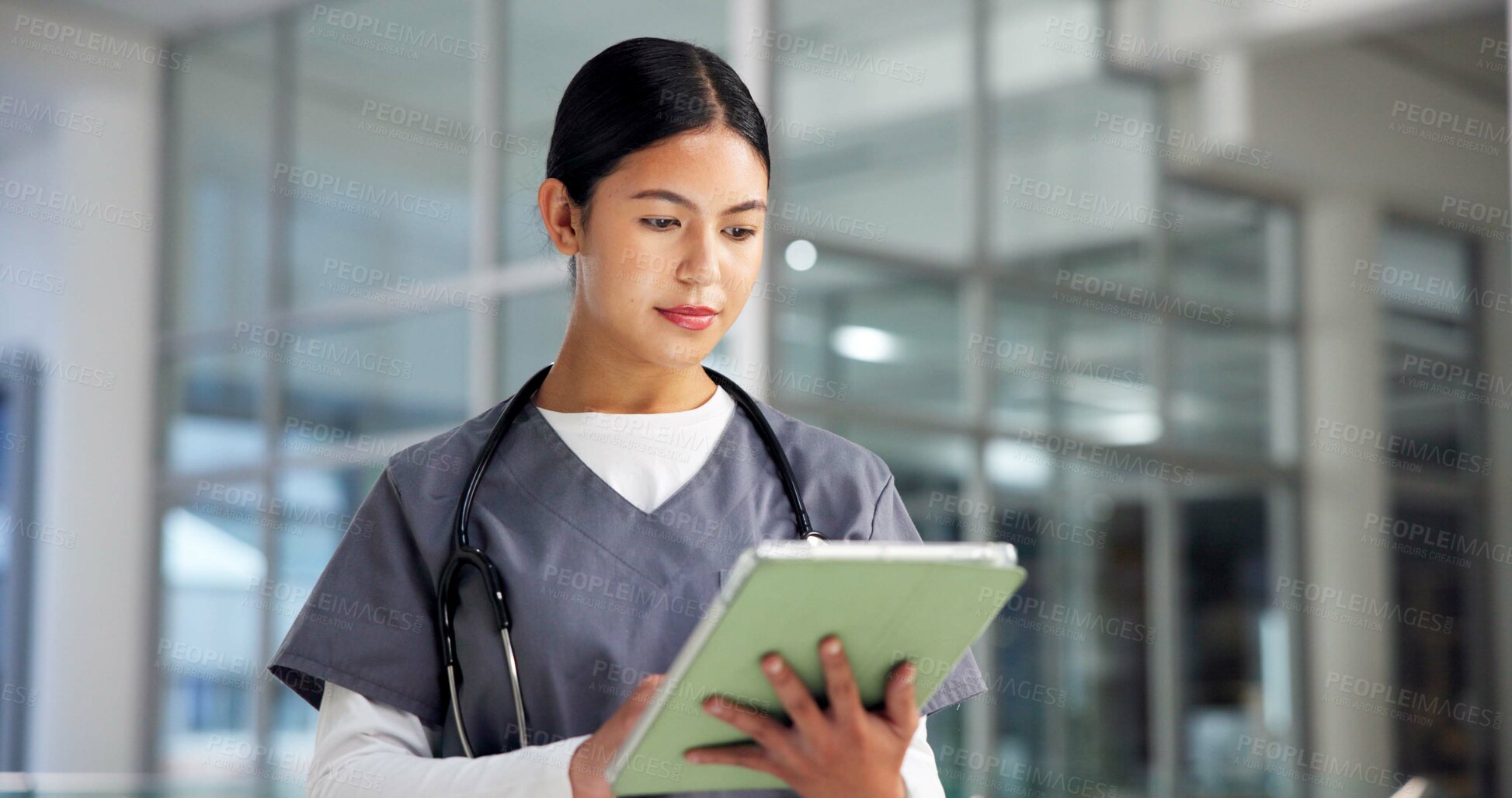 Buy stock photo Nurse, woman and tablet in hospital for healthcare report, research or check insurance information. Technology, medical professional and person with wellness email, telehealth or reading schedule