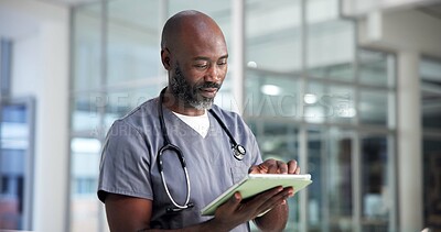 Buy stock photo Tablet, surgeon and black man in clinic for medical history, review report or research. Healthcare professional, tech and  mature nurse reading email for wellness, hospital schedule or telehealth