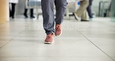 Buy stock photo Legs, person and walking in hallway of hospital for medical checkup, healthcare and clinic visit. People, shoes of patient and movement in corridor for health consultation, appointment and outpatient
