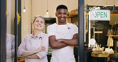 Buy stock photo Happy people, portrait and small business with open sign in cafe or ready for service. Man, woman or arms crossed with apron or smile for coffee shop, startup or welcome by front door in restaurant