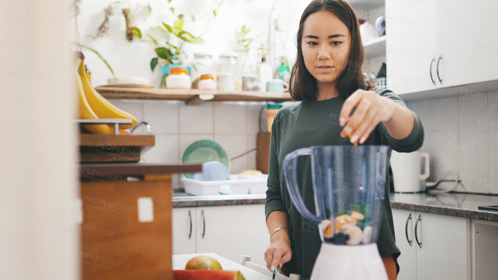 Buy stock photo Asian woman, health and fruits in blender for smoothie, detox diet or wellness in kitchen. Mixer, home and person with appliance for vegan ingredients, preparation or nutrition with organic benefits