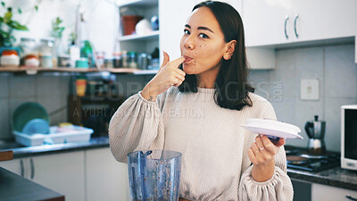 Buy stock photo Woman, blender and taste smoothie in kitchen, portrait and self care with drink, detox or diet at house. Person, milkshake and lick finger in home with appliance, weight loss or nutrition in Cambodia