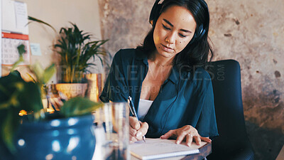 Buy stock photo Remote work, headphones and woman in home with notes for copywriting, article ideas and planning. Creative, freelancer and person with music, audio and sound and writing schedule, reminder and draft