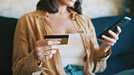 Credit card, sofa and hands of woman with phone for online shopping, internet banking and website deal. Typing, home and person with debit info on cellphone for digital purchase, payment or ecommerce
