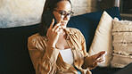 Phone call, credit card and reading with woman on sofa for Ecommerce, fintech and digital payment. Online banking, password verification and account pin with person in living room of home for order