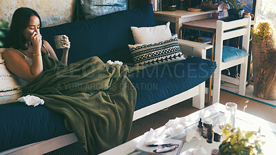 Buy stock photo Home, sick and woman on couch, tea and tissue with stress, fatigue and illness. Healing, toilet paper and person with blanket, resting and disease with virus and ginger treatment in lounge