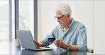 Credit card, laptop and businessman in office with online shopping, ecommerce and purchase. Computer, bank account and mature male financial manager with investment on website for finance growth.