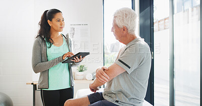 Buy stock photo Senior man, physiotherapy and woman on tablet for wellness, rehabilitation and physical therapy. Healthcare, consulting and person on digital tech with patient for medical service, help or recovery