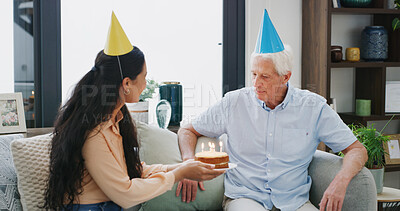 Buy stock photo Celebration, birthday cake and senior man with woman, candles and milestone in home. Happy, people and elderly father with adult daughter for party, bonding and together in living room for retirement