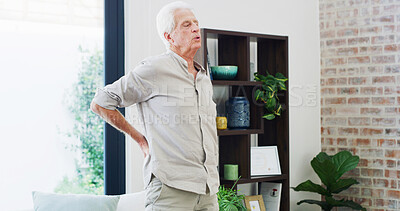 Buy stock photo Back pain, fatigue and retirement with old man in living room of home for condition or discomfort. Posture, spine and stiff with senior person in apartment for arthritis or muscle inflammation