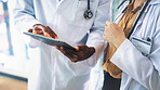 Collaboration, hands and tablet with doctors in hospital together for medical consulting. App, conversation and healthcare with people in clinic for assistance, diagnosis review or results feedback