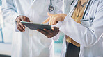 Collaboration, hands and tablet with doctors in hospital together for medical consulting. App, pointing and healthcare with people in clinic for assistance, diagnosis review or results feedback