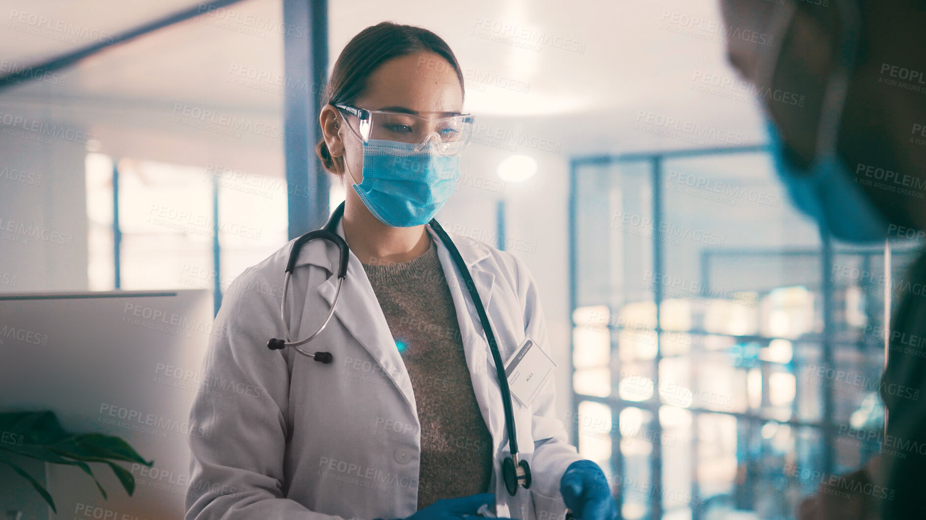 Buy stock photo Consulting, face mask or medical with doctor and patient in hospital for appointment or injection. Goggles, ppe and safety with healthcare professional woman in clinic for cure, shot or vaccine