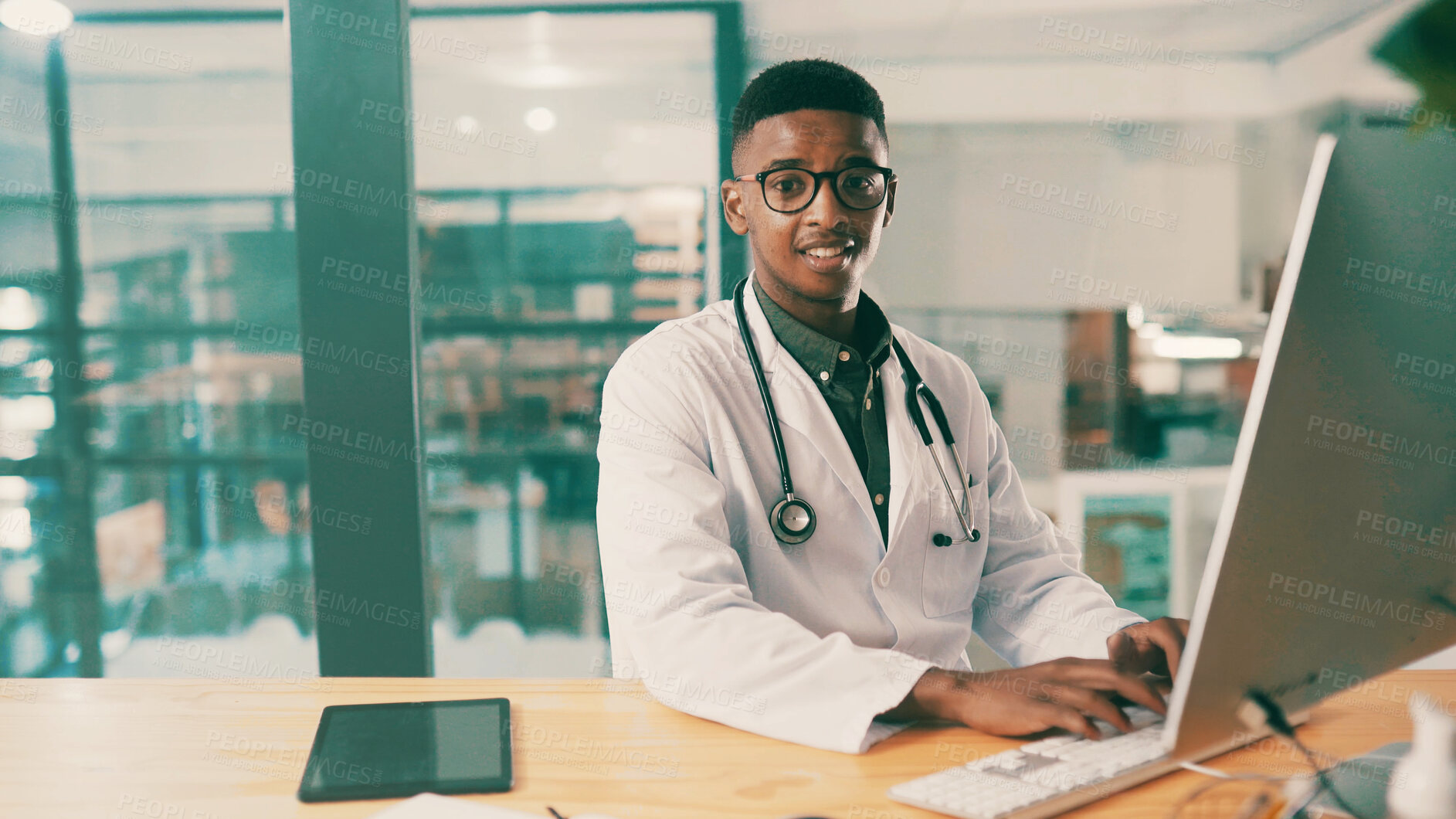 Buy stock photo Computer, portrait and typing with doctor black man at desk in hospital for results review. Healthcare, medical and report with medicine professional in office at clinic for agenda or schedule