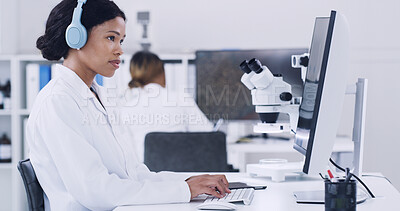 Buy stock photo Computer, music and science with woman in laboratory for medical research or pharmaceuticals. Headphones, healthcare and typing with scientist at desk for work on clinical trial or experiment
