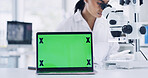 Woman, scientist and microscope with green screen on laptop for research, medical study and sample. Person, equipment or pc for experiment, observe organisms and online results of vaccine development