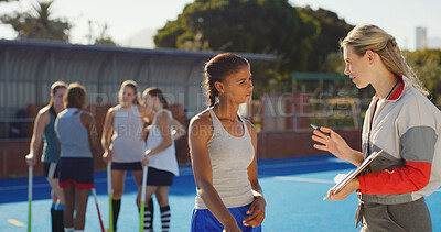 Buy stock photo Coach, strategy or clipboard with student athlete outdoor for hockey match, tournament or competition. People, sport manager talk to team captain on turf for game plan, tactical feedback or formation