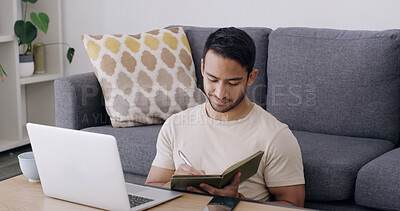 Buy stock photo Man, laptop and writing with diary in home for journalism, remote work or schedule planning. Male person, journalist or freelancer taking notes with computer, notebook or book for agenda or tasks
