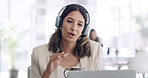 Headphones, laptop and virtual meeting with business woman in coworking office for development webinar. Coffee, computer and video call with employee in workplace for feedback, review or update
