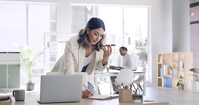 Buy stock photo Business, woman and phone for voice message in office for feedback, agenda update and contact source. Person, laptop or audio recording for article schedule, writing reminder and chat for publication