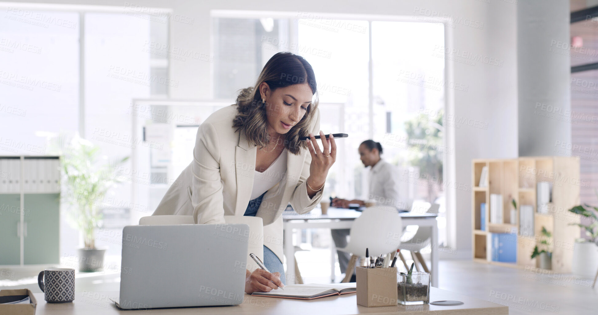 Buy stock photo Business, woman and phone for voice message in office for feedback, agenda update and contact source. Person, laptop or audio recording for article schedule, writing reminder and chat for publication
