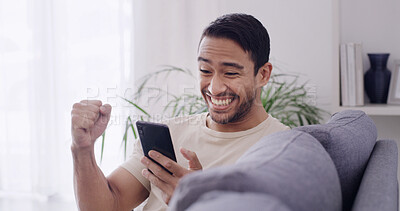 Buy stock photo Happy man, sofa and winning with phone in home for online deal, good news or lottery prize. Excited, male person or smile with mobile smartphone or fist pump on couch for investment or bonus in house