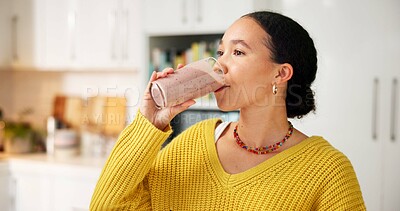Buy stock photo Morning, woman and drinking smoothie in kitchen for breakfast shake, healthy gut and nutrition. Nutritionist, person and meal replacement drink in home for body detox, digestive health and benefits