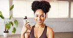 Portrait, water bottle and woman with smile, exercise or confidence with hydration. Happiness, athlete or person in health club, wellness or fitness with workout, liquid or refreshing drink with aqua