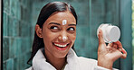 Cosmetics, cream and thinking with woman in bathroom for beauty, retinol moisturizer and reflection. Dermatology, lotion and skincare with person in home for vision, glow and facial treatment