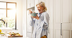 Senior woman, fruit salad and eating in kitchen, smile and excited with organic vegan meal at home. Mature person, happy and laugh with bowl for nutrition, diet and wellness in retirement at house