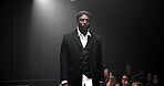 Man, model and runway with luxury for fashion show, garment collection or designer brand. Male person, crowd or audience with clothing line or outfit for publicity or new aesthetic trend on catwalk