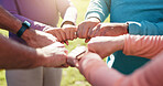Senior people, hands together and circle for motivation, solidarity or fitness support in outdoor park. Teamwork, mature group and friends for collaboration goals, mission or workout for exercise