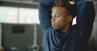 Buy stock photo Fitness, man or thinking with stretching in gym for muscle relief, start exercise or getting ready. Serious, african person or arm warm up at health club for training preparation, reflection or space