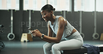 Buy stock photo Black woman, gym and smile with phone for social media, message or online post and break. African person, sports center and fitness with laugh on internet for funny video, meme or notification