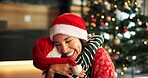 Christmas, mom and child hug in home for love, care and support with parent on holiday with bokeh. Xmas, happy mother and embrace girl for family connection, gratitude and thank you with daughter