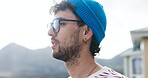 Thinking, outdoor and man view sunset for inspiration, evening reflection or holiday perspective. Calm observation, weekend travel or person with glasses for insight, vacation or ideas with space