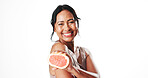 Portrait, skincare and woman with grapefruit, beauty and facial treatment with vitamin c and studio. White background, natural cosmetics and mature person with fruit, anti aging benefits and glow